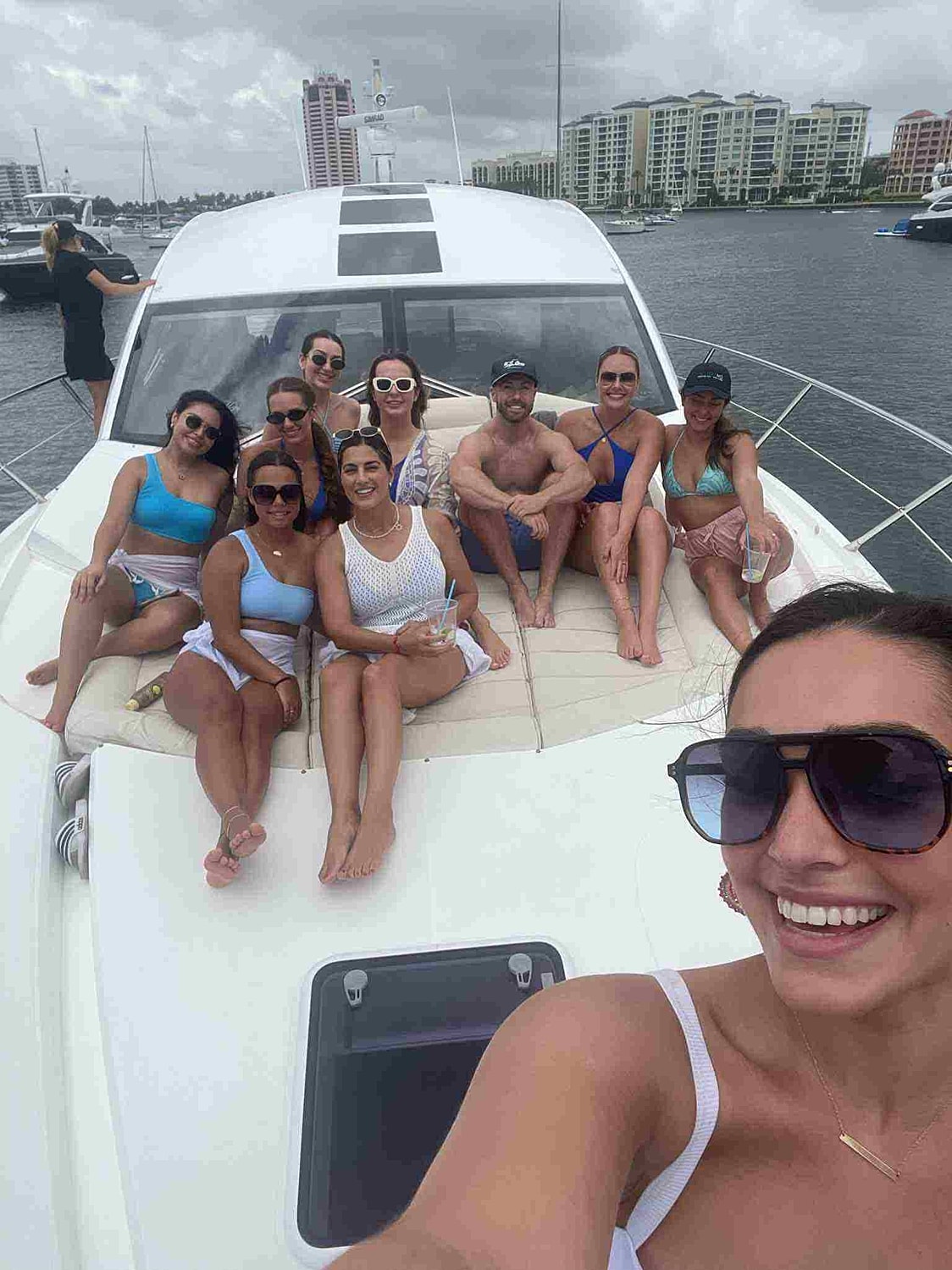 Group of friends enjoying a day on a yacht.