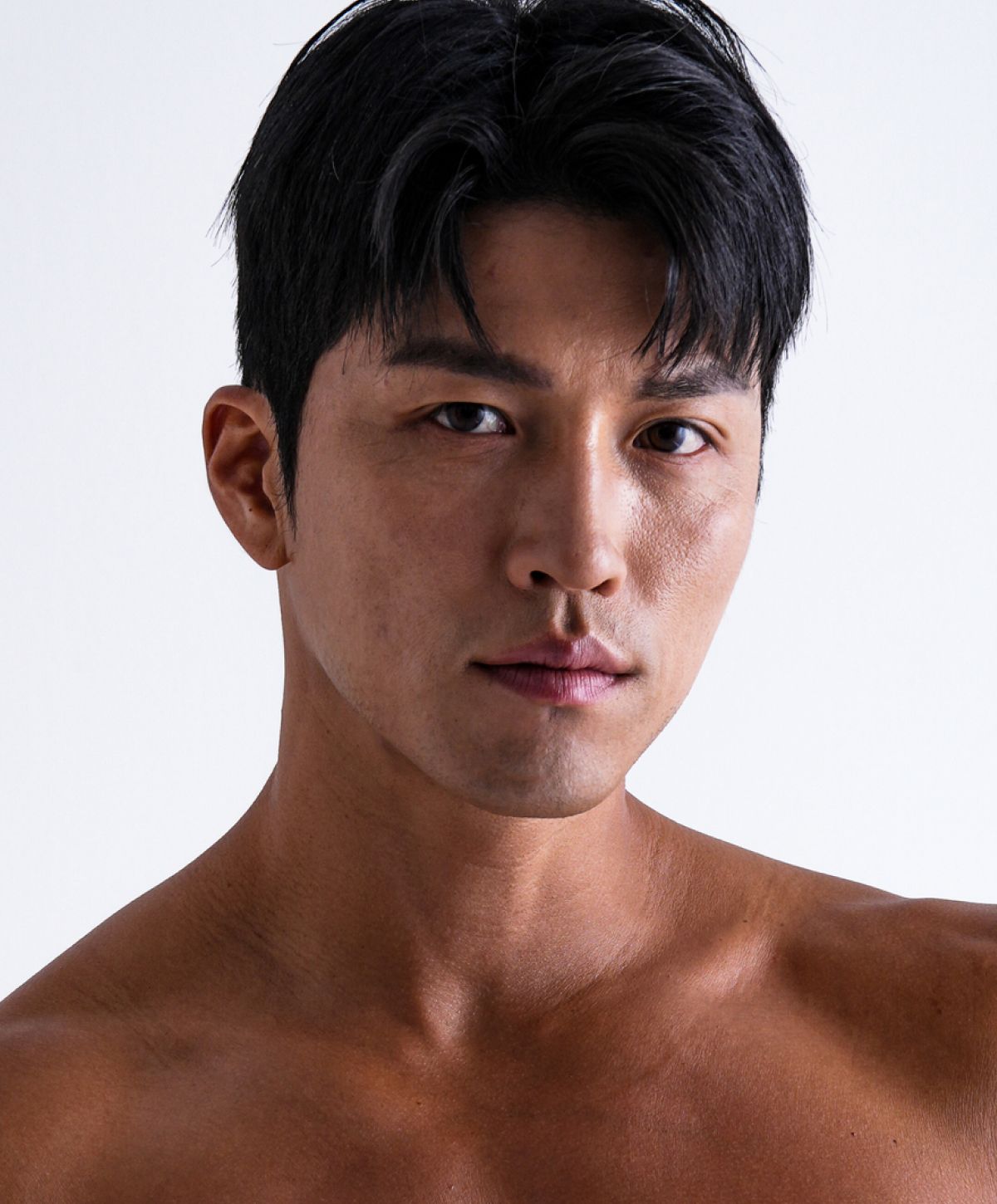 Close-up of a man with short dark hair.