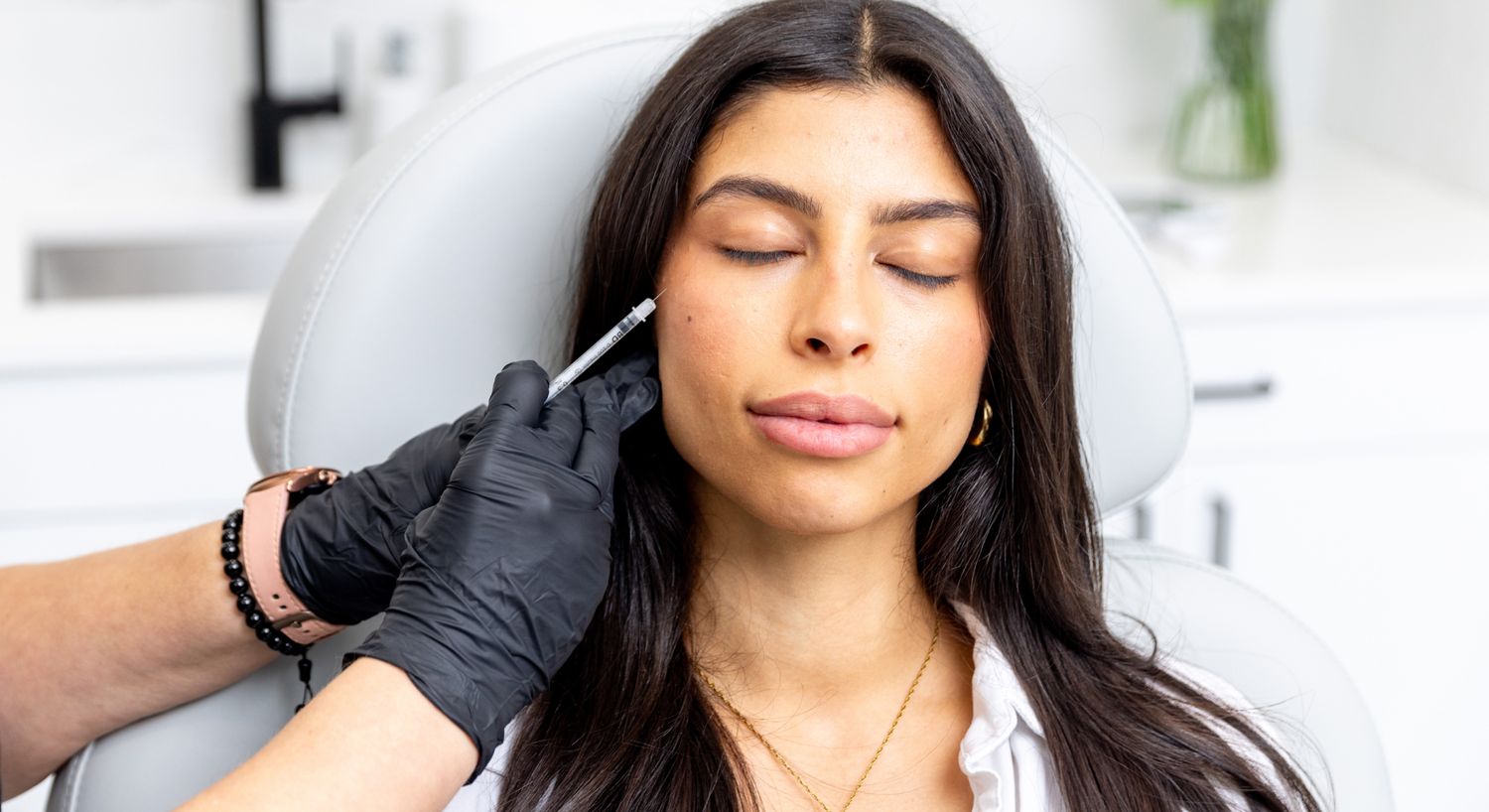 Patient receiving cosmetic treatment in clinic setting.