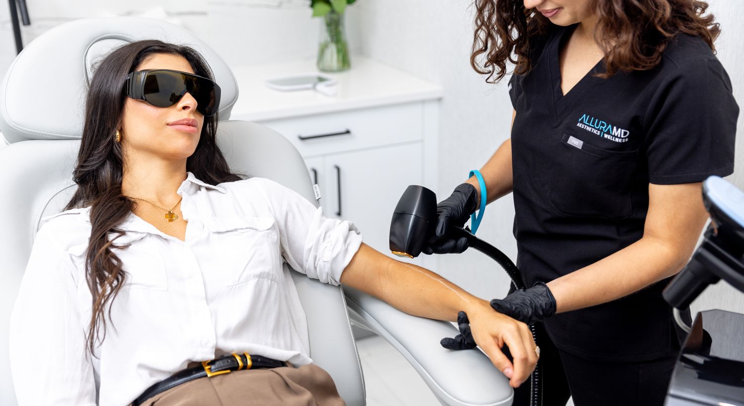 Laser Hair Removal patient model receiving treatment on her arm