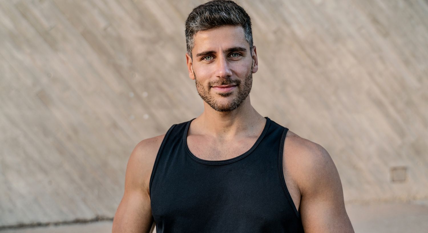 Micronutrient Testing patient model smiling in a black tank top