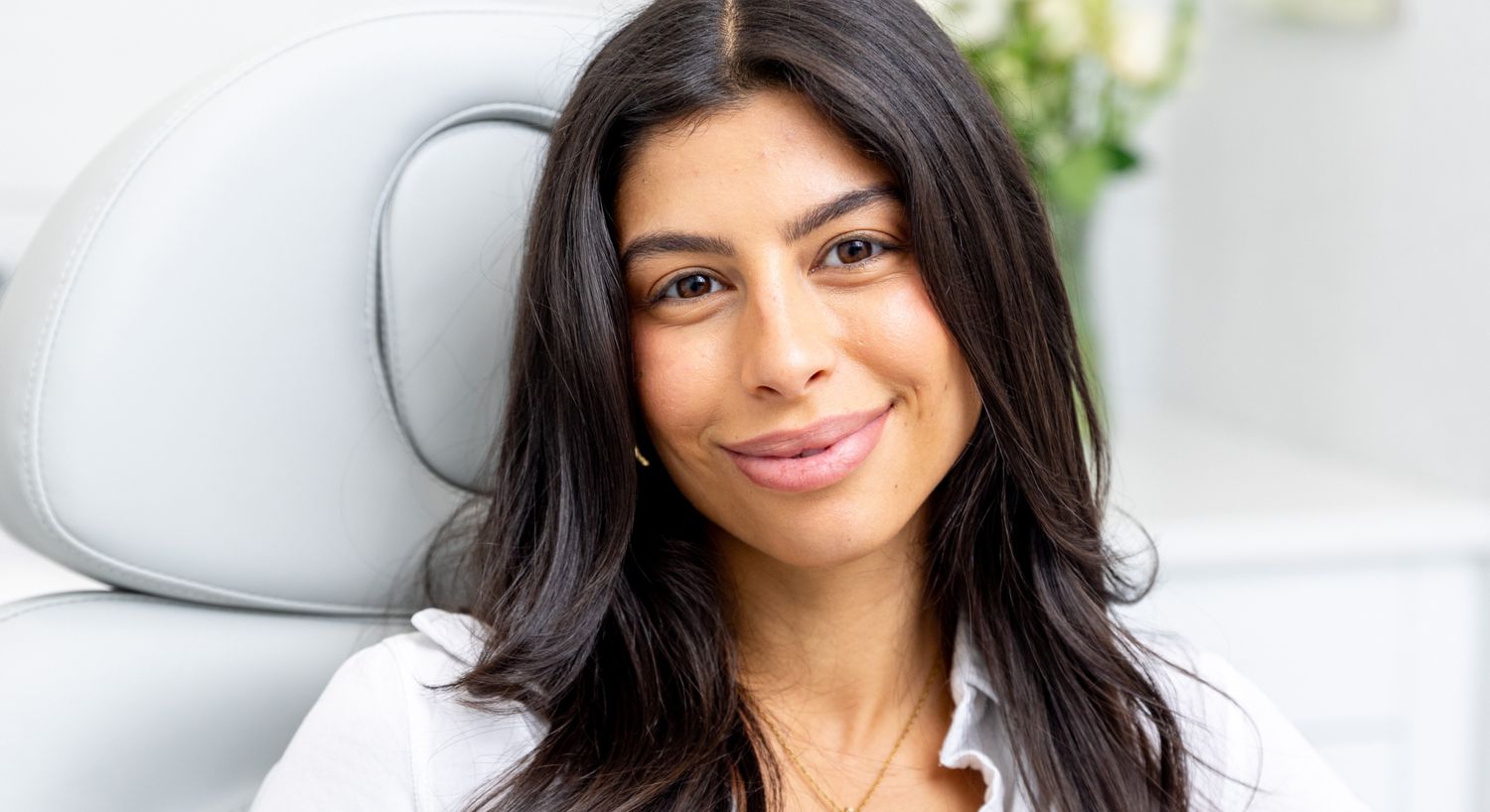 restylane patient model smiling in a med spa chair